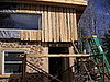 Scaffolding. You can see the insulation between the planks.